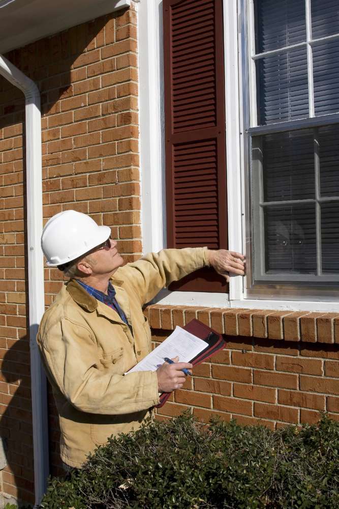 Pic of painting and repair Estimator Estimate inspecting for repair as part of our exterior painting services